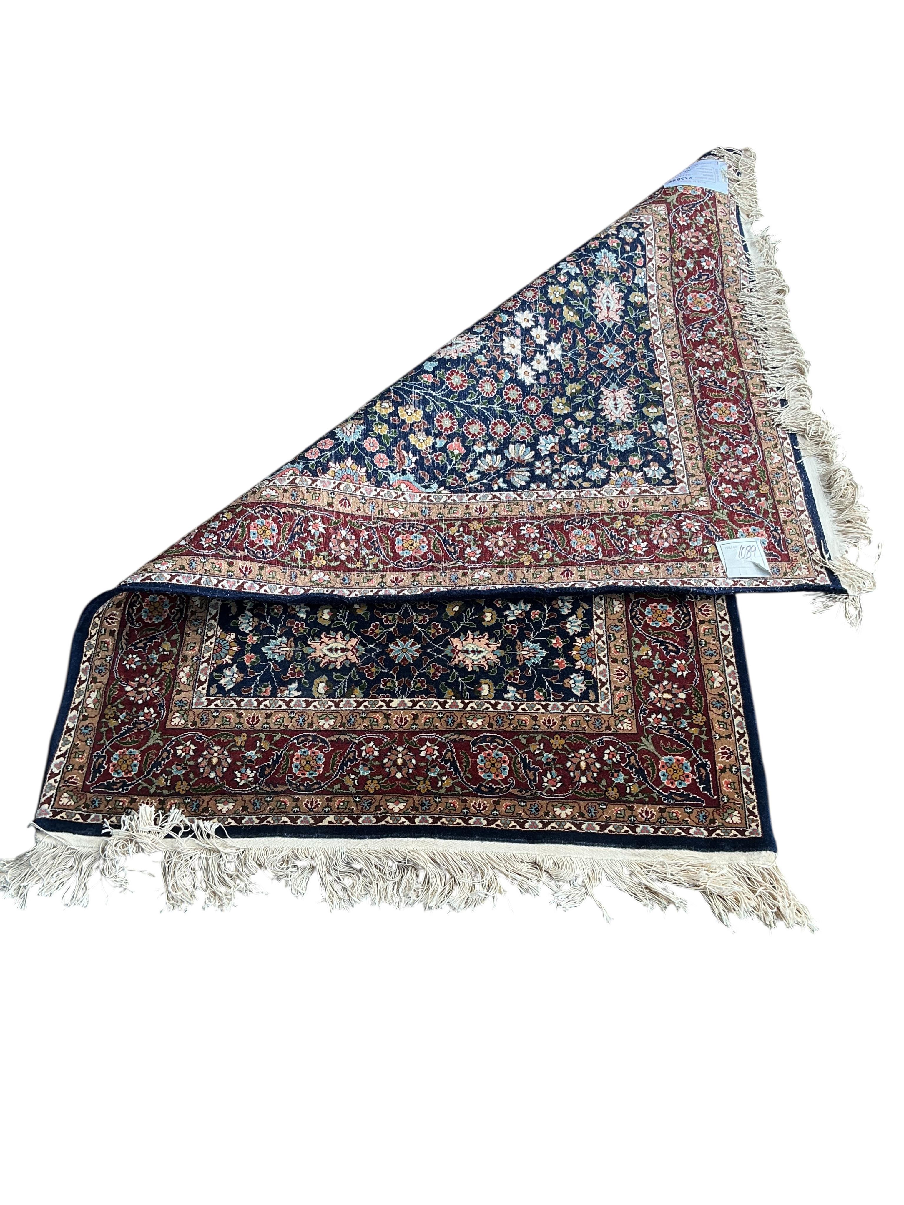 A Hereke Turkish blue ground rug, 150 x 100cm